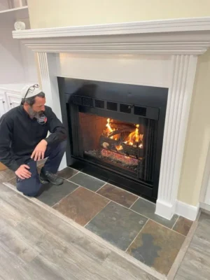 Nadav inspecting a gas fireplace - Texas Chimney LLC