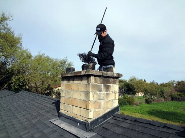 Professional chimney sweep by Texas Chimney LLC