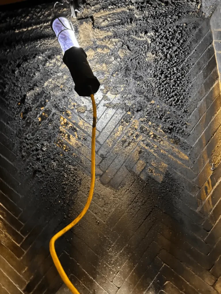 Chimney being cleaned with specialized equipment
