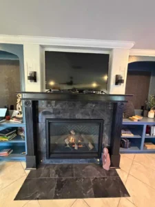 an interior living space featuring a fireplace as the central focal point.