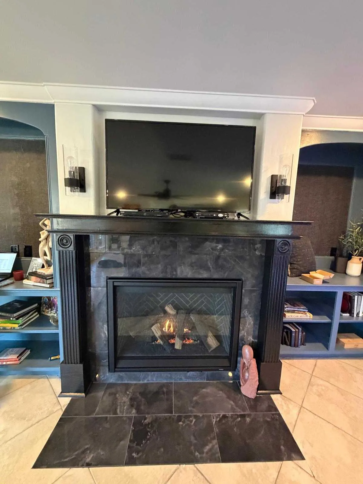 an interior living space featuring a fireplace as the central focal point.