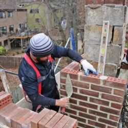 A technician replacing a chimney in houston texas